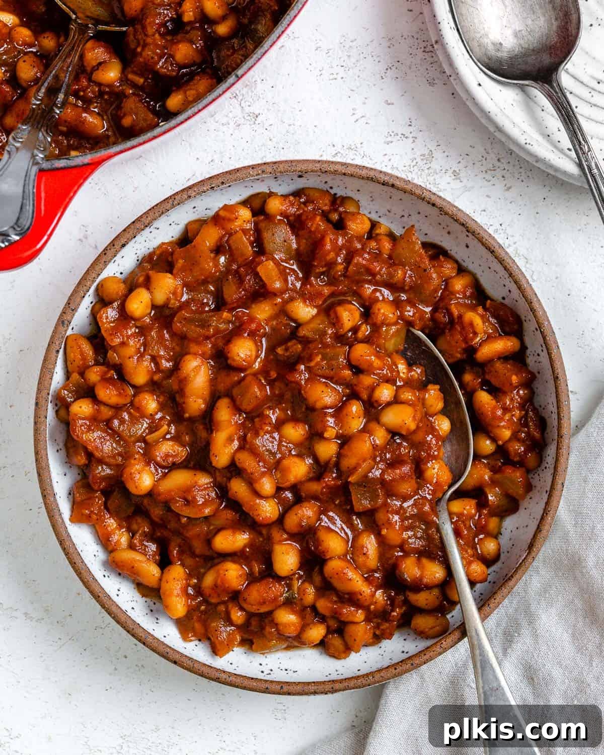 A close-up shot of the completed Homemade Vegan Baked Beans [Boston Style], showing the rich, thick sauce and tender beans, served in a bowl.