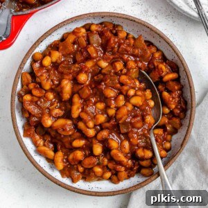 completed Homemade Vegan Baked Beans [Boston Style] plated in a bowl against a light surface