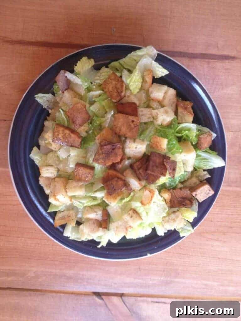 Plant-Based Budget Challenge for Two: Week One 10 Dinner plate filled with caesar salad with croutons and tofu.