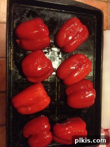 Budget Plant-Based Challenge for Two Week 2 9 Halved red bell peppers, brushed with olive oil, arranged on a baking sheet and ready for broiling.