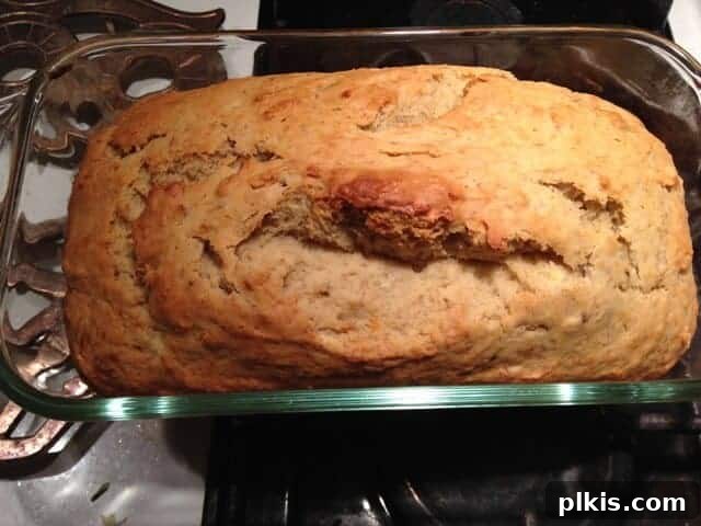 Frugal Vegan Feasts for One: Week 2 Progress 3 Top view of a loaf of baked banana bread in a glass pan.