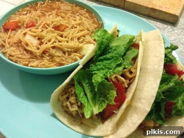 Solo Budget Plant Based Challenge Week 3 11 A small bowl of fideo pasta next to two sweet potato tacos.