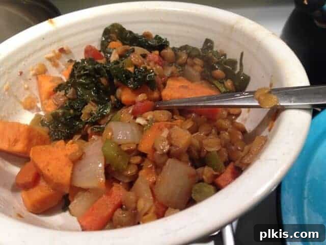Solo Budget Plant Based Challenge Week 3 9 Dinner bowl of lentils with kale and yam.