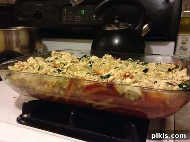 My Solo Budget Vegan Journey: Week 4 4 Baked tofu ricotta pasta in a rectangle dish on the stovetop.