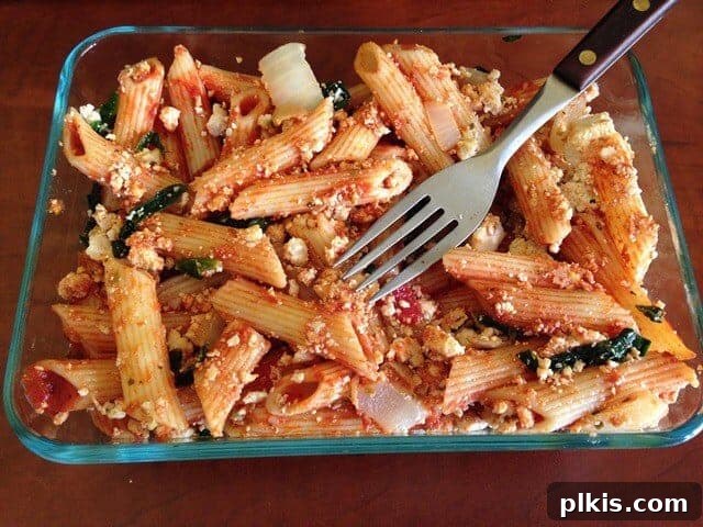 My Solo Budget Vegan Journey: Week 4 6 A glass container of leftover tofu ricotta baked pasta.