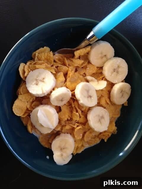 My Solo Budget Vegan Journey: Week 4 8 A bowl of cornflake cereal topped with sliced bananas.