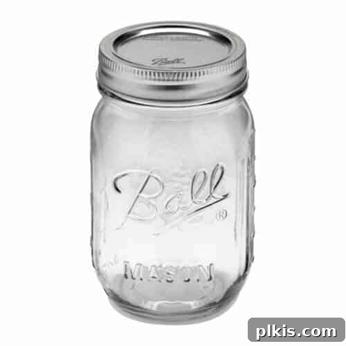Assortment of mason jars filled with various pantry items like oats and beans.