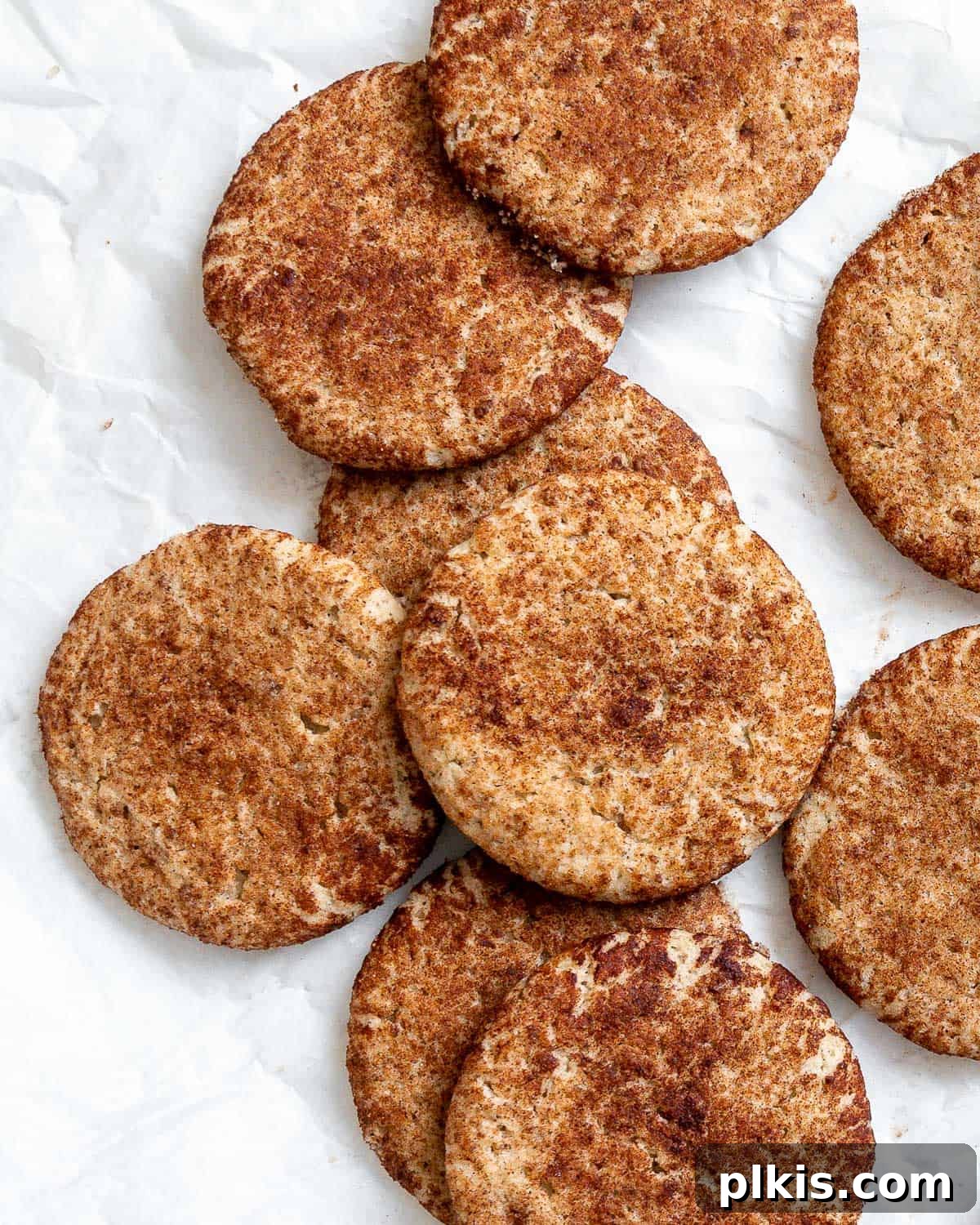 24 Festive Vegan Christmas Cookie Delights 9 Completed Easy Vegan Snickerdoodles on a white surface.