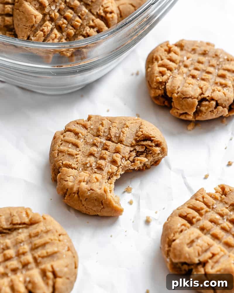 24 Festive Vegan Christmas Cookie Delights 13 Completed Vegan Peanut Butter Cookies on white surface.