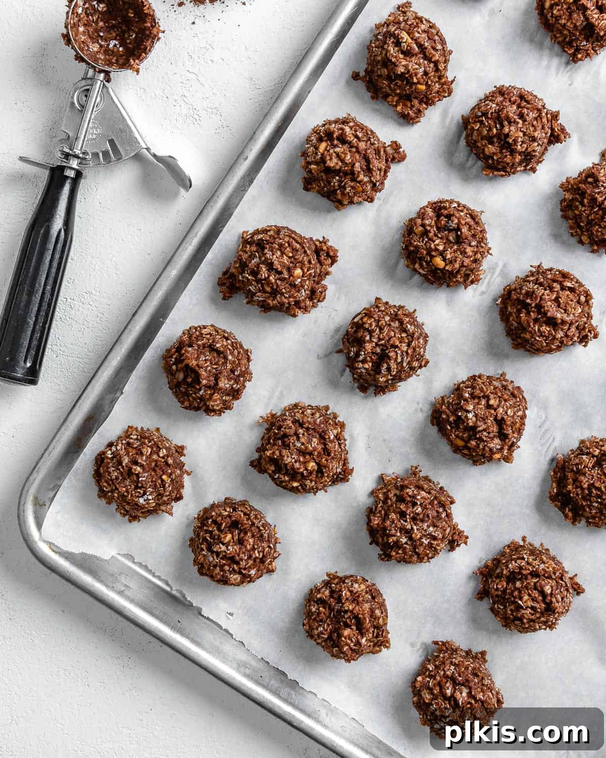 24 Festive Vegan Christmas Cookie Delights 19 Completed California Cookies scattered on a baking tray.