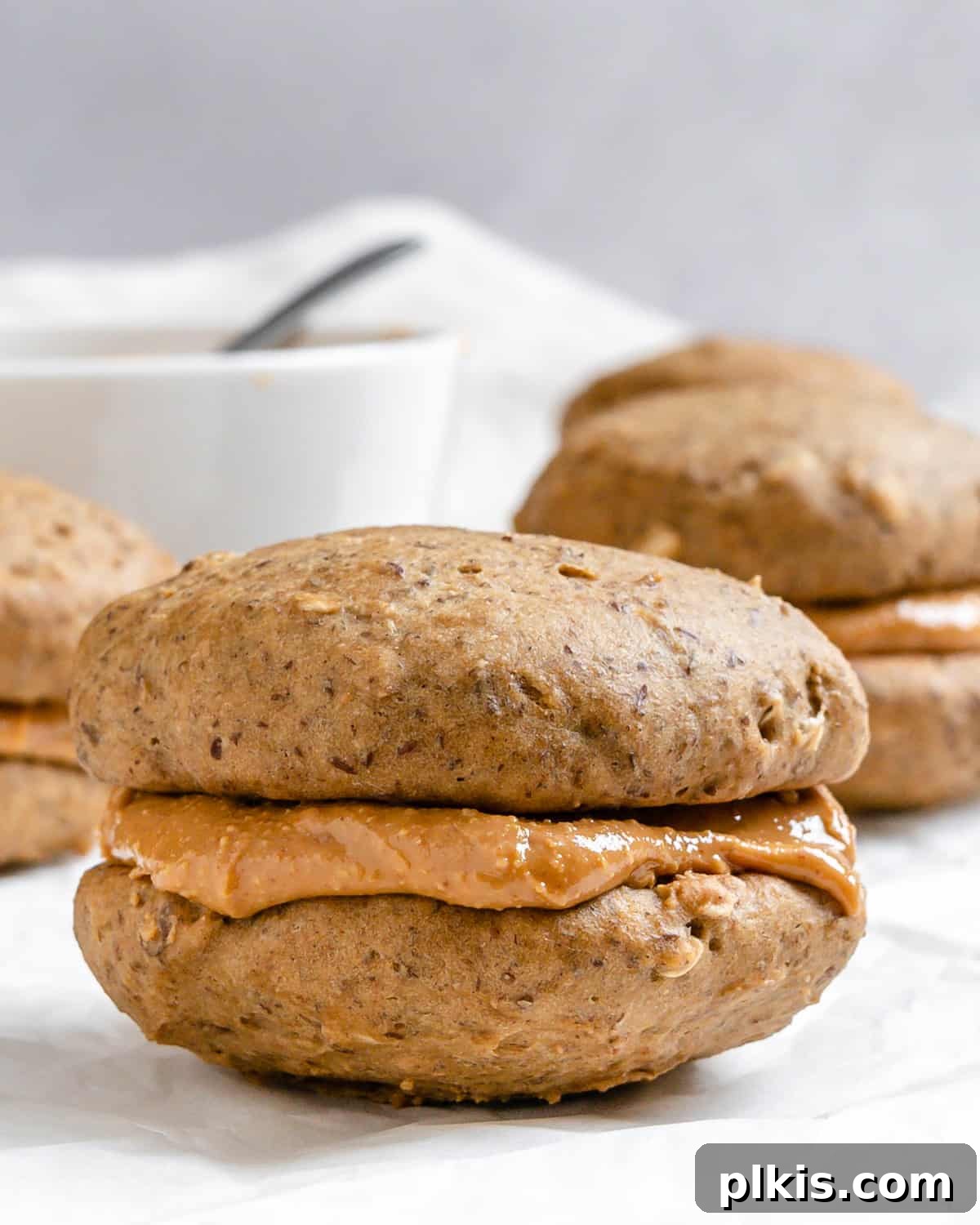 Completed Vegan Peanut Butter Cookies [With Filling| Sandwich Cookies] on a white surface.