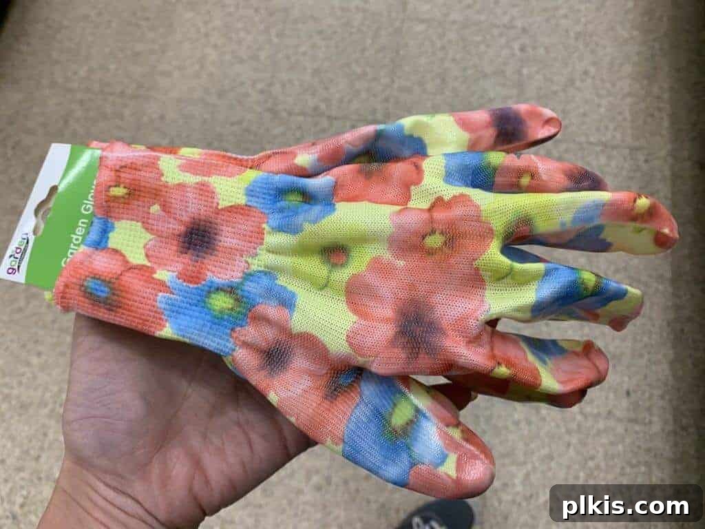 Sprouting Savings: Dollar Tree Garden Essentials 12 Hand wearing a pair of comfortable green garden gloves from Dollar Tree.