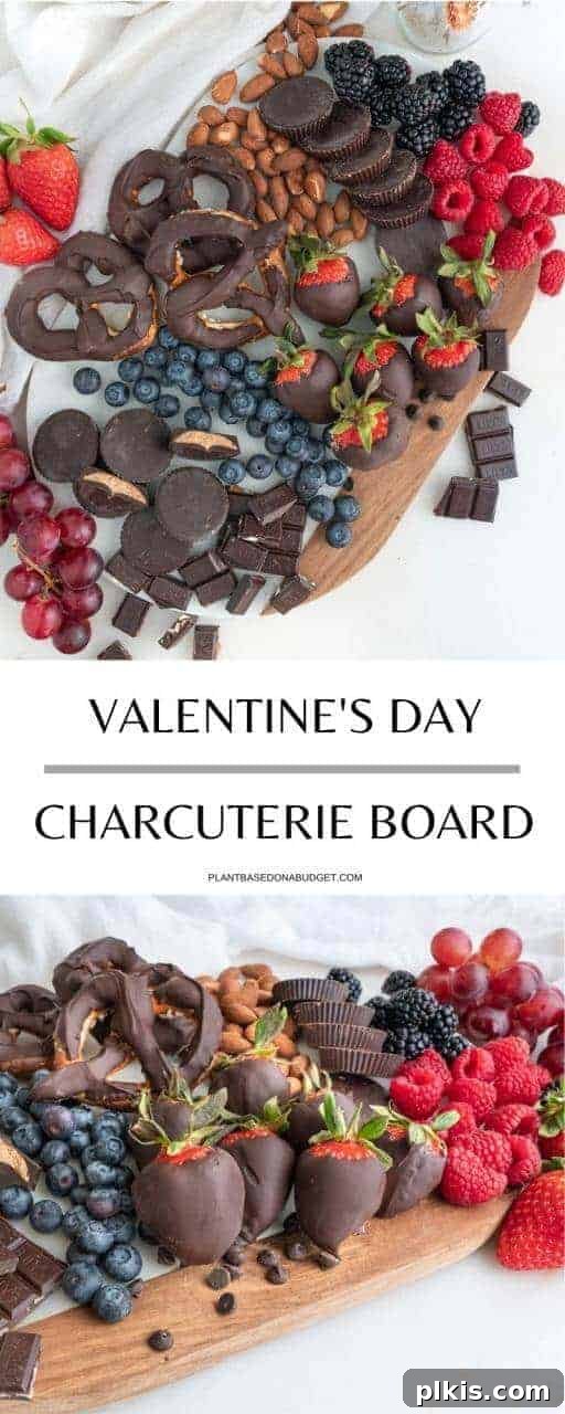 Valentine's Day Charcuterie Board Pinterest Graphic Pinterest graphic featuring a Valentine's Day dessert charcuterie board with chocolate pretzels, peanut butter cups, and various berries.