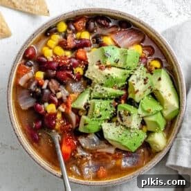 completed Quick Mexican Bean Soup [Stove + Crockpot] in a bowl against a light background