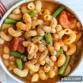 completed Pasta Bean and Tomato Soup in a white bowl against a light surface