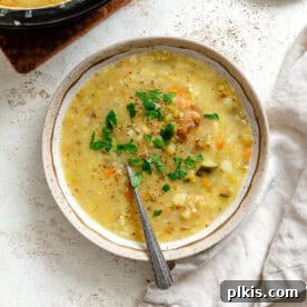 Completed Vegan Potato Soup (with vegetables) in a bowl and pot.