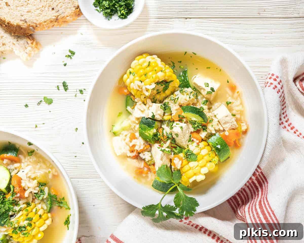 23 Soul-Soothing Vegan Soup Recipes 11 Whit bowl of caldo de tofu soup.