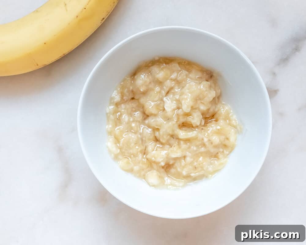 Best Vegan Egg Replacers for Baking Mashed Banana in a Bowl