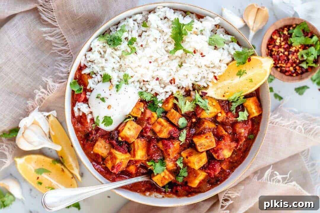 Vegan Butter Chicken Vegan Butter Chicken served with white rice and topped with cilantro leaves