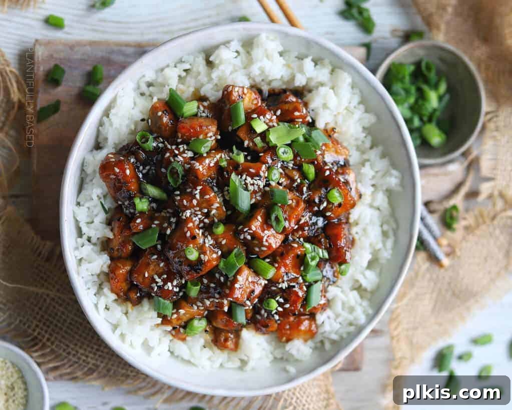 Sesame Tofu Sesame Tofu Served with White rice on a bowl