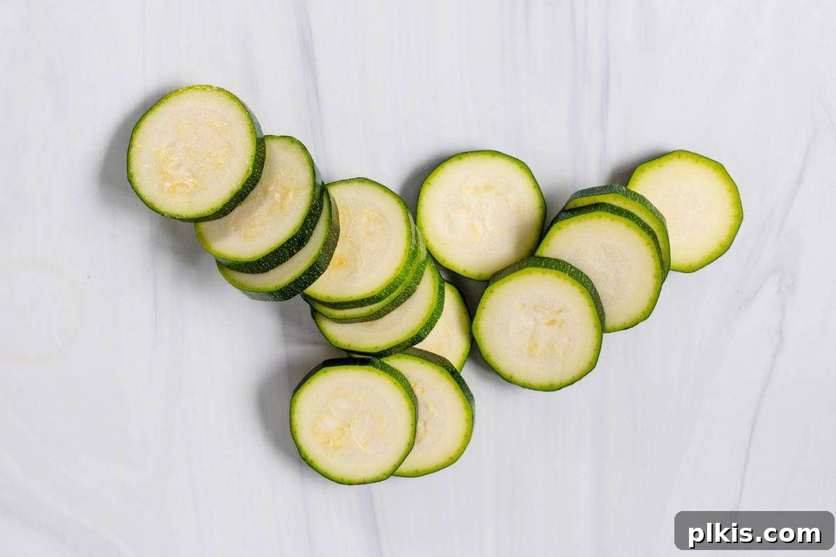The Basics of Cutting Sliced Zucchini on a Marble Surface