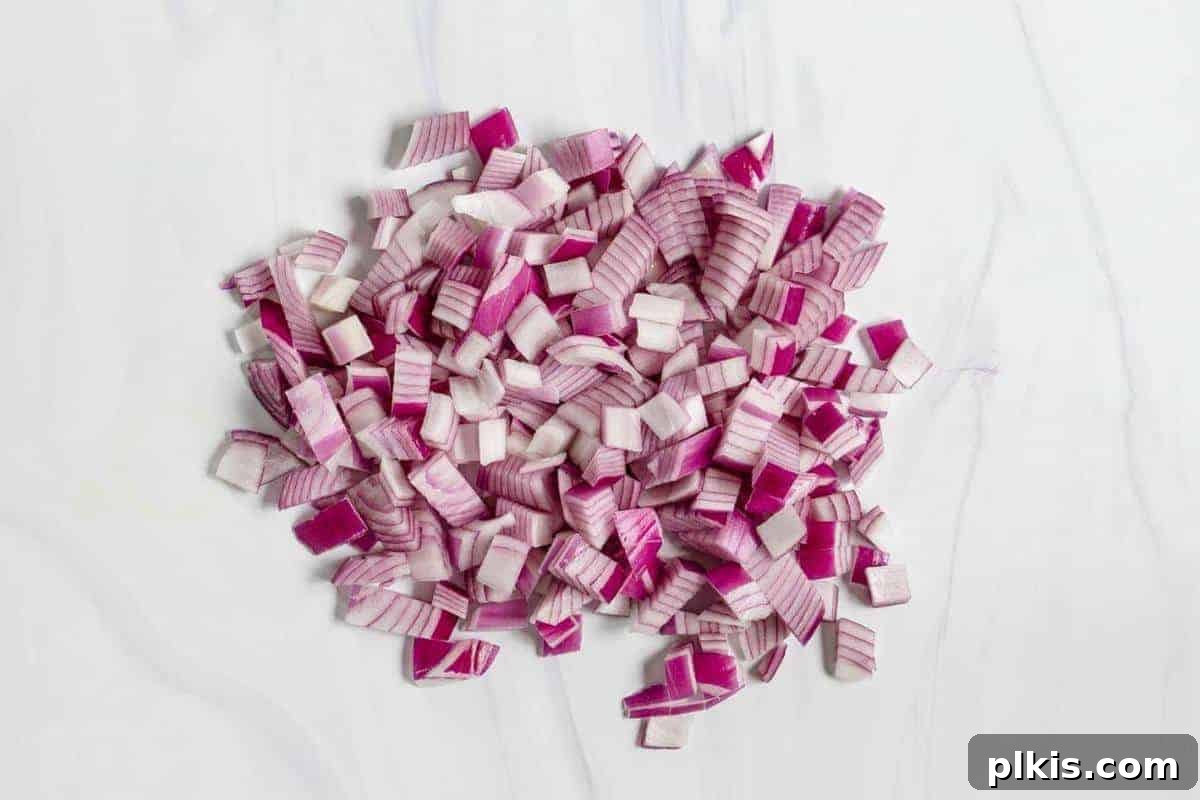 The Basics of Cutting Diced Red Onions on a Marble Surface