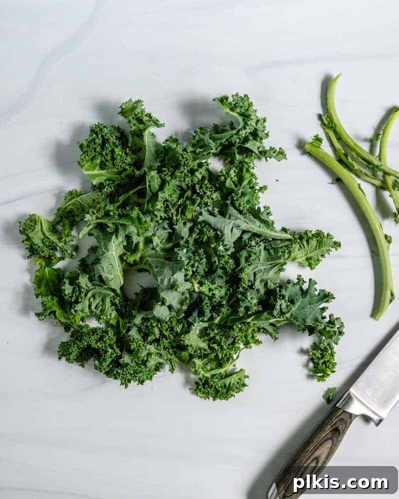 Guide to Kale: How to Remove The Stem Curly Kale Removing Stem on a Marble Surface