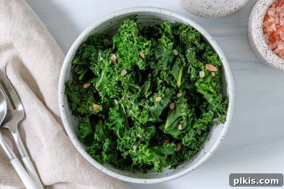 Kale 101 Steamed Curly Kale on a White on a Marble SurfaceBowl