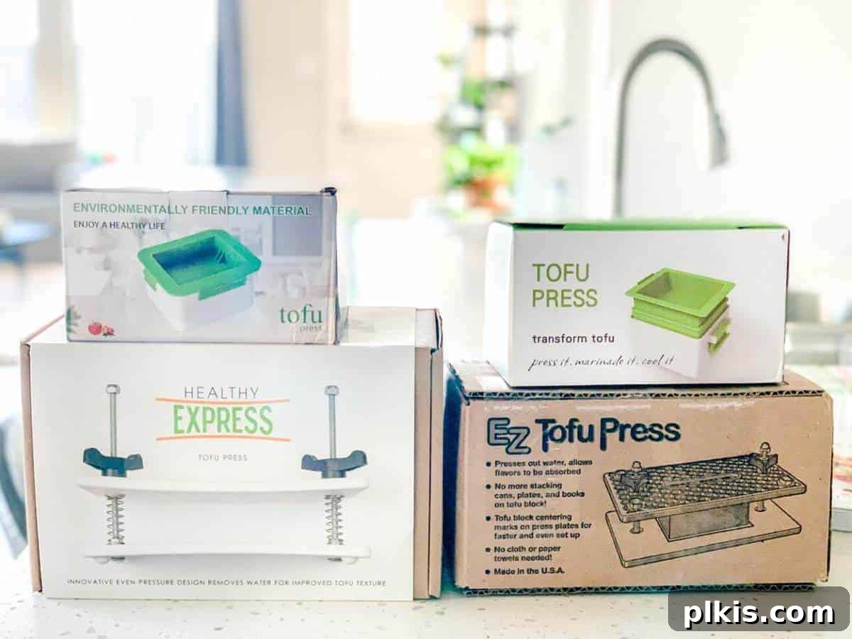 Best Tofu Presses for Every Kitchen A selection of the best tofu presses laid out on a clean kitchen counter, showcasing different types and designs.