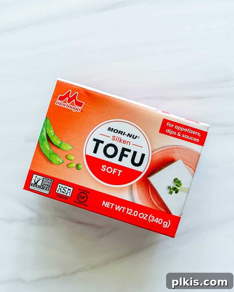 Ultimate Tofu Guide four different packaged tofu blocks on a white background