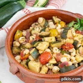 A close-up of Summer Zucchini and Hominy, ready to be served and enjoyed.