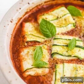 Completed zucchini ravioli artfully arranged in a bowl against a crisp white background.