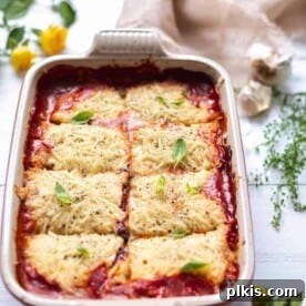 A vibrant and hearty vegan zucchini lasagna, showcasing its layers of fresh ingredients.