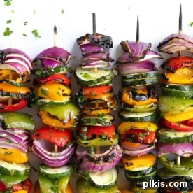 A close-up of beautifully grilled veggie skewers, showcasing their vibrant colors and perfect char.