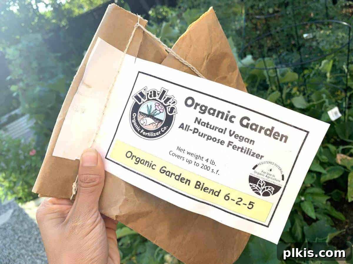 Walt's Vegan Fertilizer Walts vegan fetilizer in a brown and white bad with a green leafy background