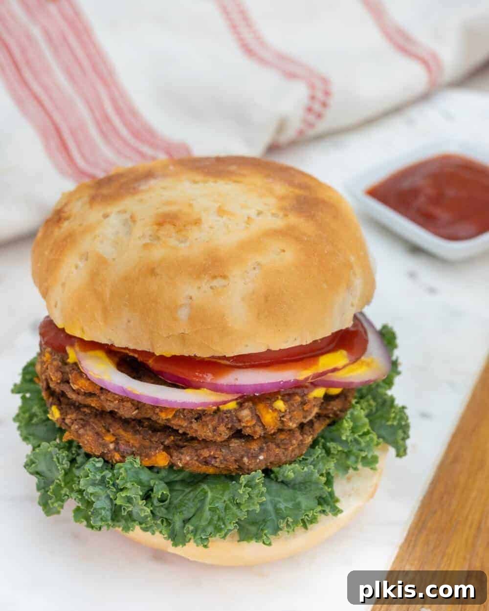 Sweet Potato Jalapeno Burger Sweet Potato & Jalapeño Burger on a white tray with a red and white towel and. sauce in a white background