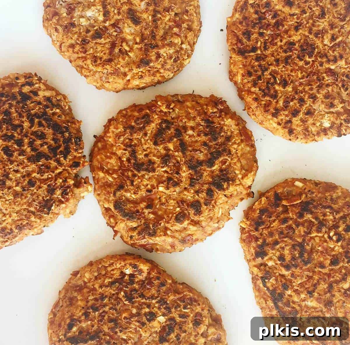 The Easiest Burger You'll Ever Make - Seriously. six burger patties in a white background