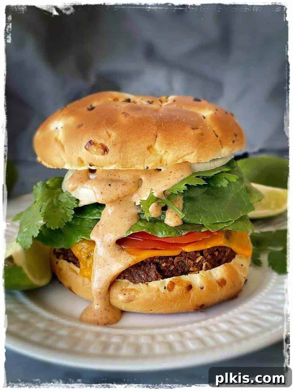 Vegan Chorizo Burgers with Spicy Maple Lime Mayo Vegan Chorizo Burger on a white plate in a gray background