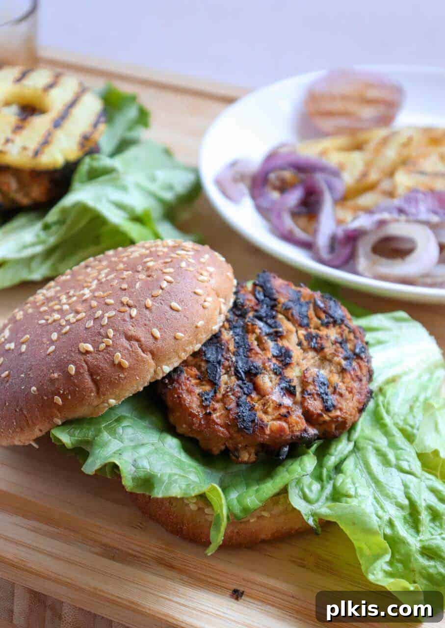 White Bean Teriyaki Burgers White Bean Teriyaki Burger with various ingredients on plates on a wood surface