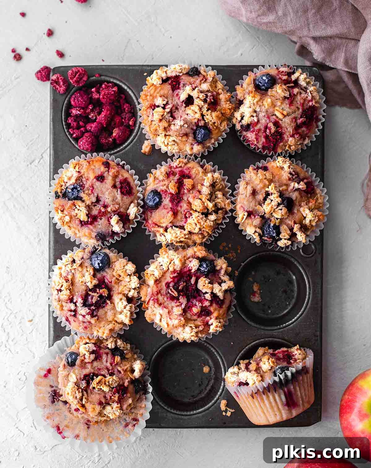 48 Irresistible Vegan Apple Delights 18 Completed Vegan Apple Berry Crumble Muffins in muffin tray.