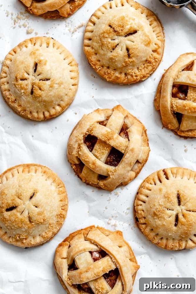 48 Irresistible Vegan Apple Delights 19 Completed Apple Pie Cookies on a white surface.