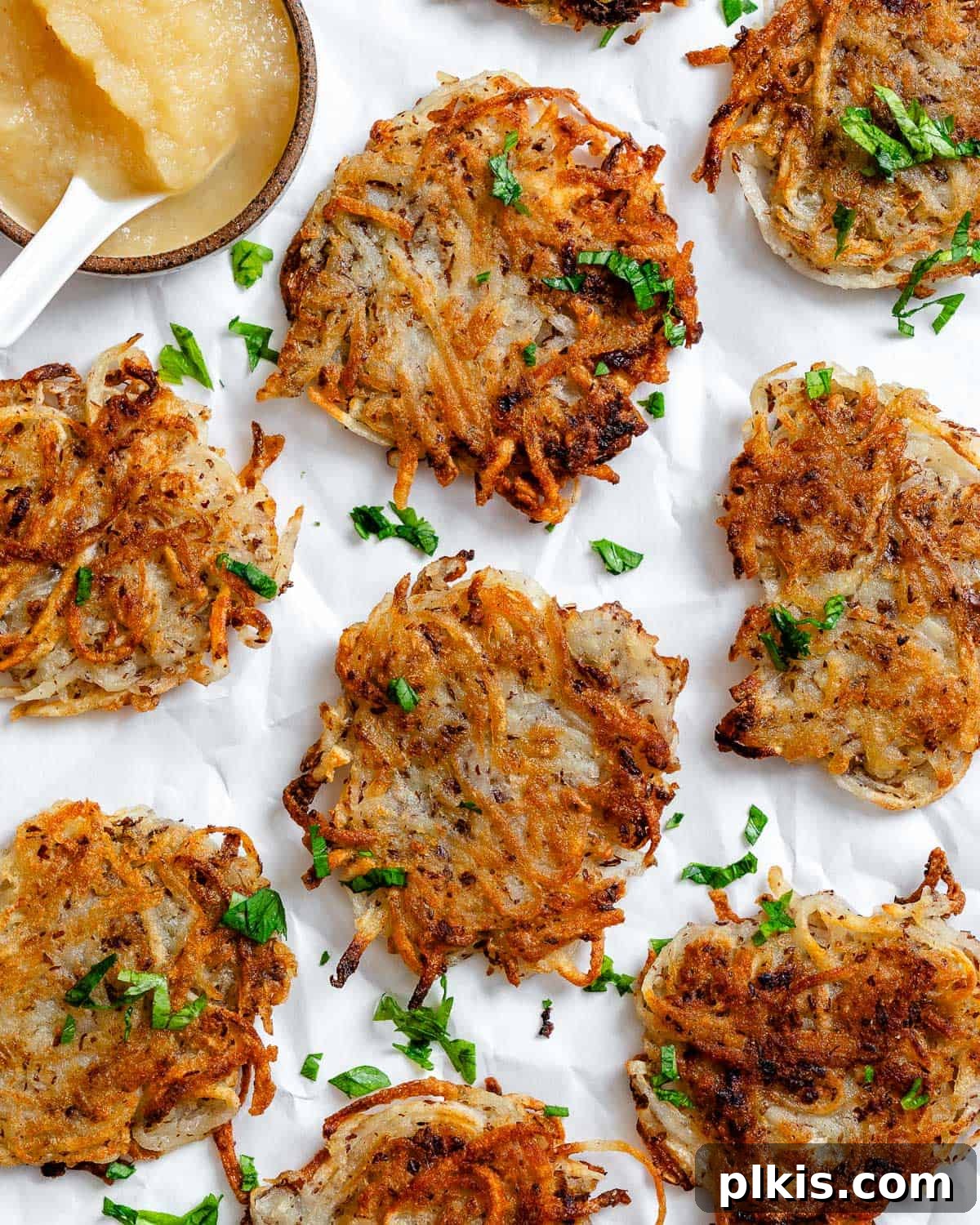48 Irresistible Vegan Apple Delights 30 Completed Vegan Potato Latkes on a white surface.