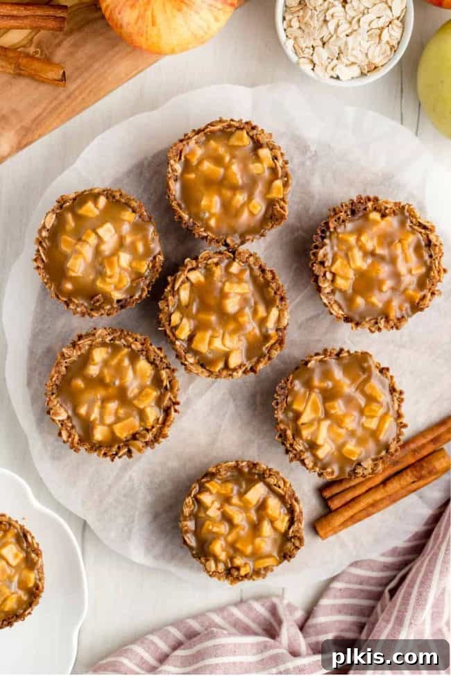 48 Irresistible Vegan Apple Delights 33 Completed Mini Apple Pies with Caramel on a plate.