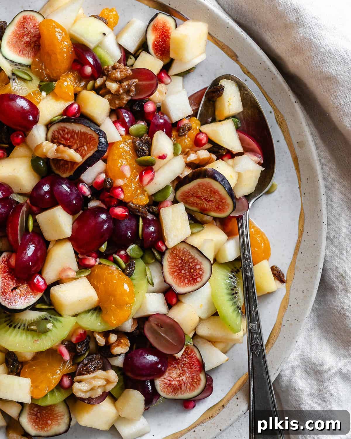 48 Irresistible Vegan Apple Delights 40 Completed Healthy Thanksgiving Fruit Salad in a bowl.