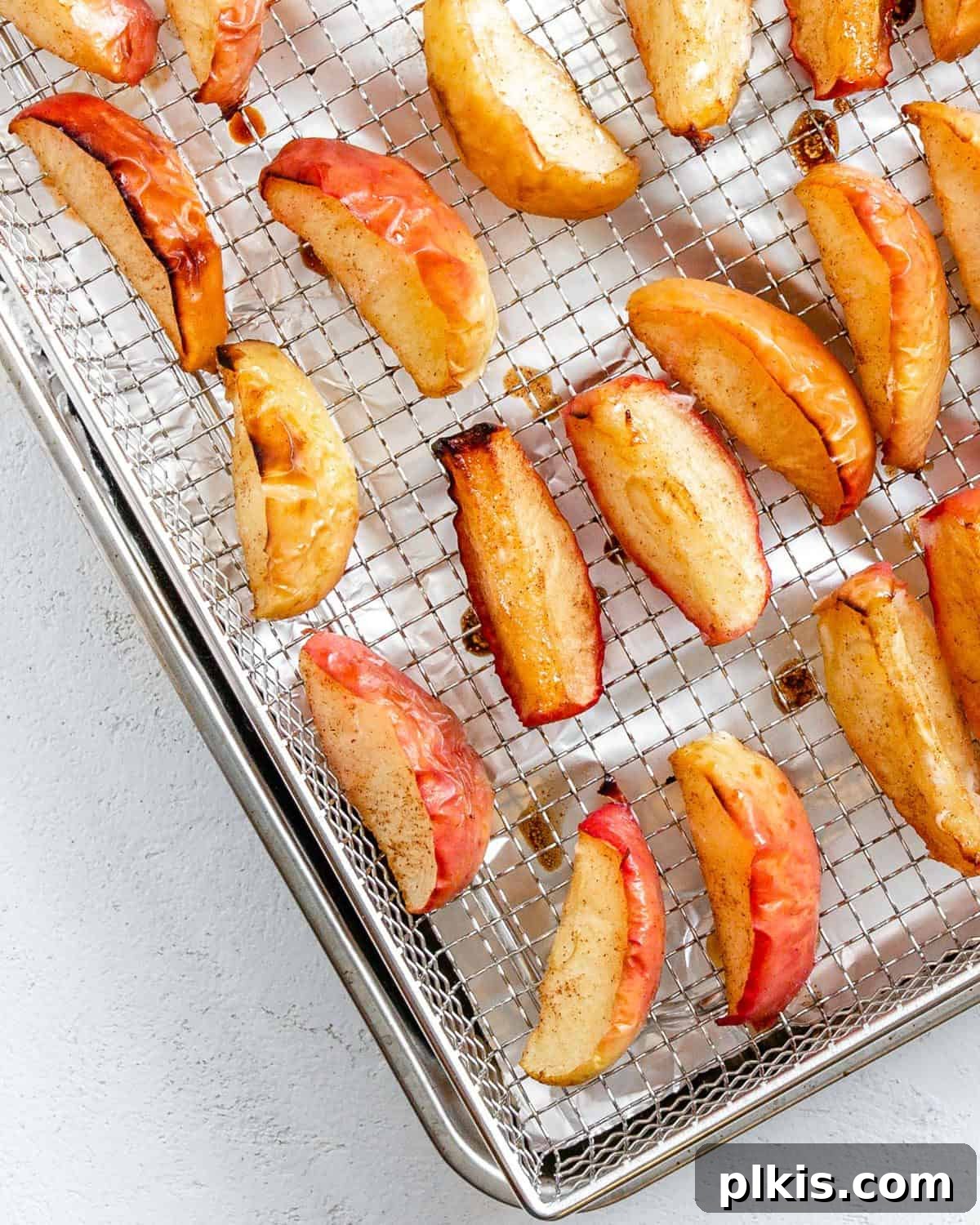 48 Irresistible Vegan Apple Delights 43 Completed Air Fryer Apples on a cooling rack.