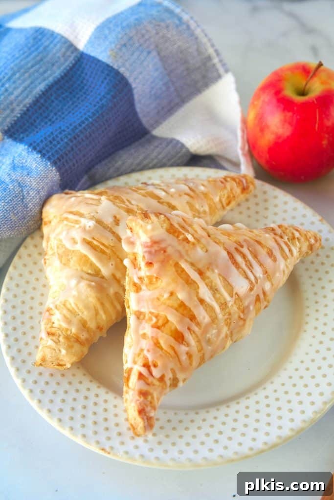 48 Irresistible Vegan Apple Delights 44 Completed Vegan Apple Turnovers on a plate.