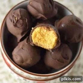 A smaller image of vegan coconut flour pumpkin truffles in a bowl against a colorful background.