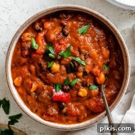 A smaller image of Vegan Pumpkin Chili, showcasing its rich texture and inviting appearance, suitable for both crockpot and stove preparation.