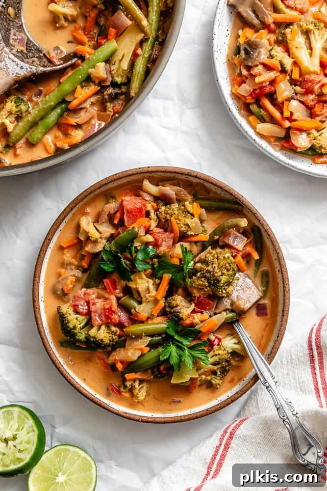 Vibrant 30-Minute Vegan Thai Red Curry 2 Vibrant Vegan Thai Red Curry in a bowl, garnished with fresh herbs, ready to be served