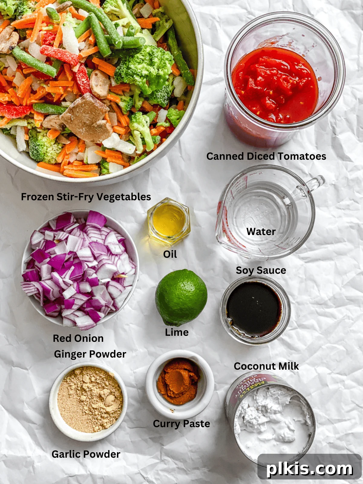 Vibrant 30-Minute Vegan Thai Red Curry 3 Arrangement of fresh and canned ingredients for Vegan Thai Red Curry on a white surface